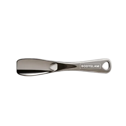 Chrome Bodyslam spoon with handle and hole, lying on a white background. Peoples CBD - Make Life Better Everyday!